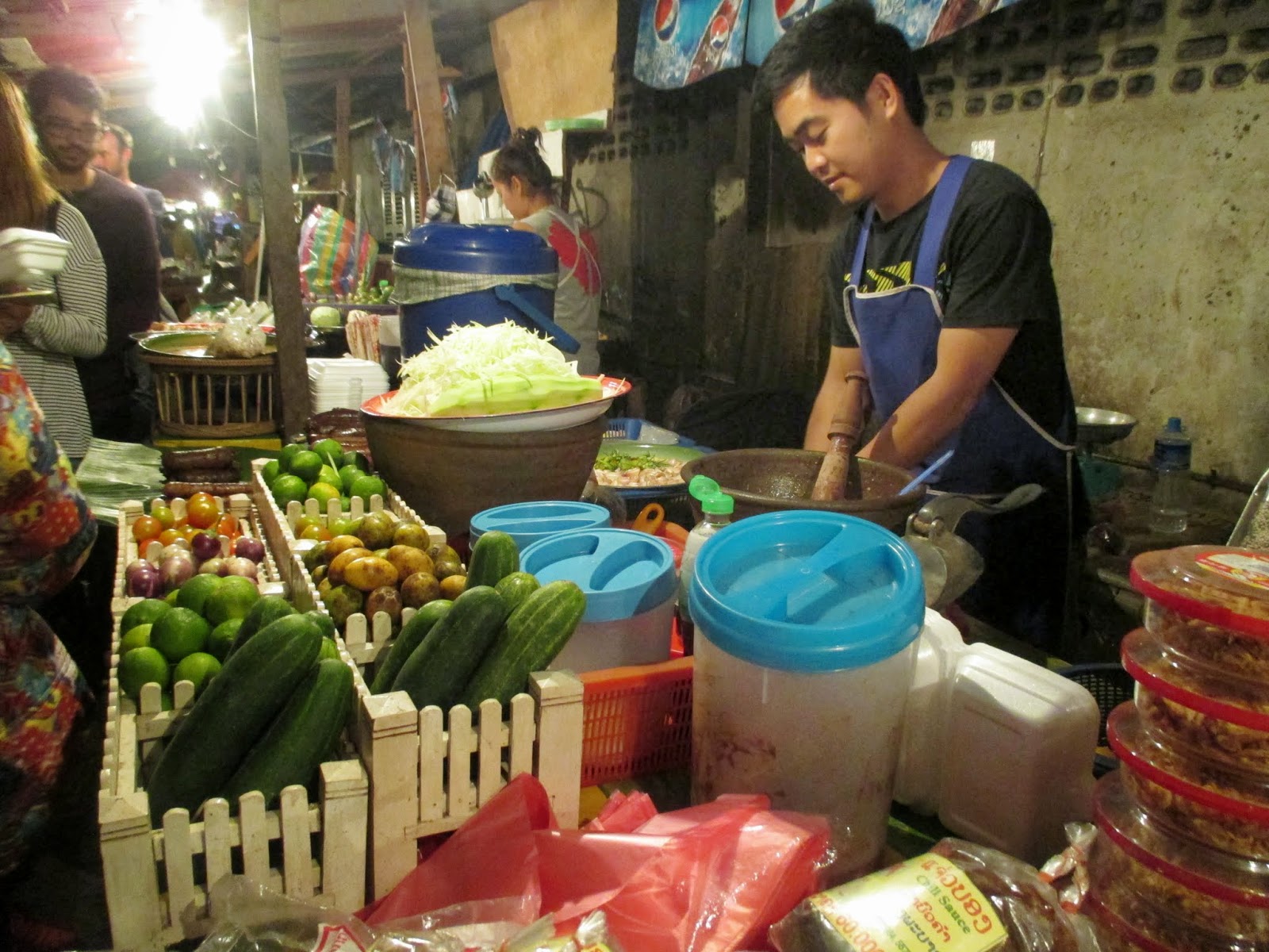 A food store is next to the entrance of night market in Luang Prabang