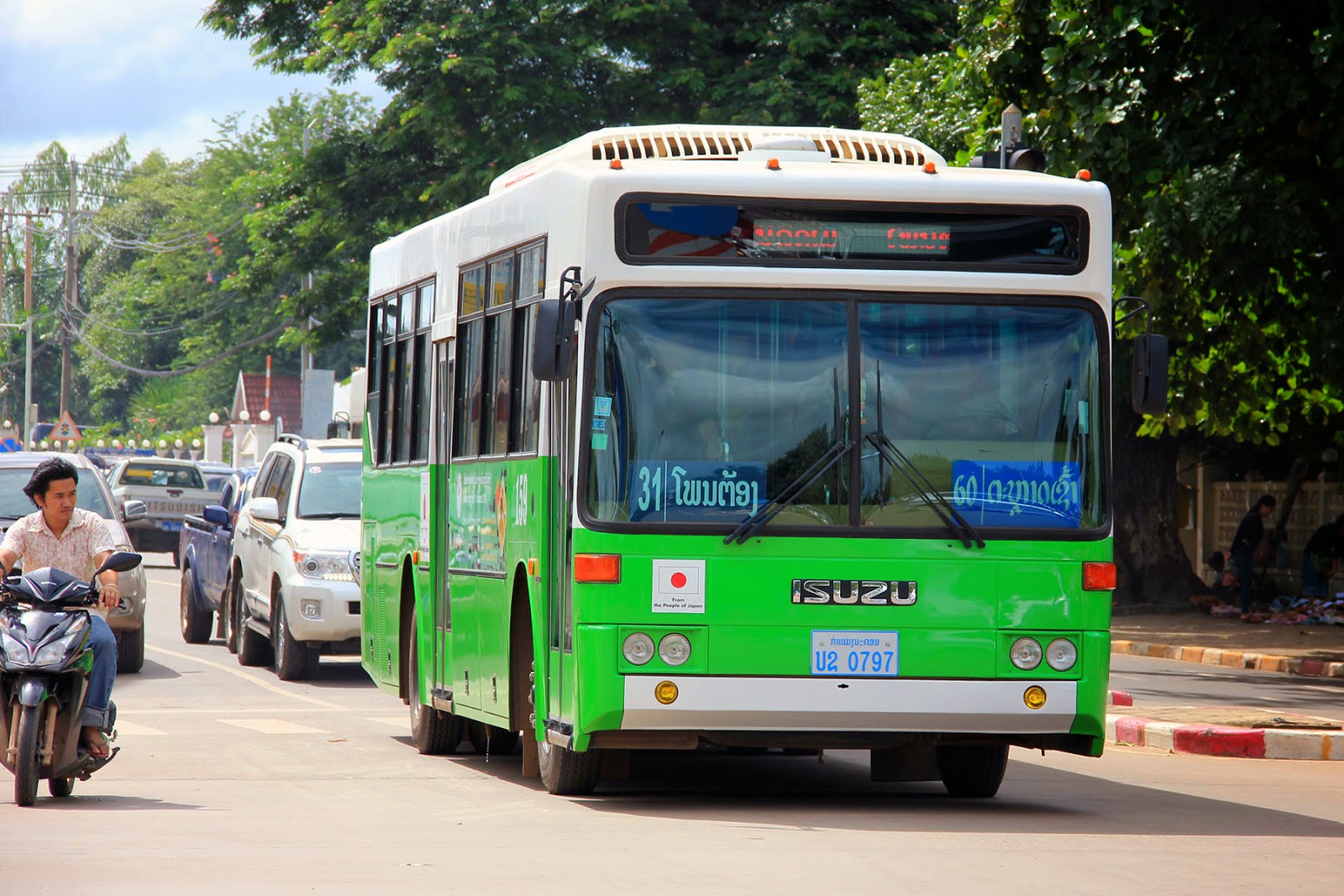 The typical green and white bus in Laos